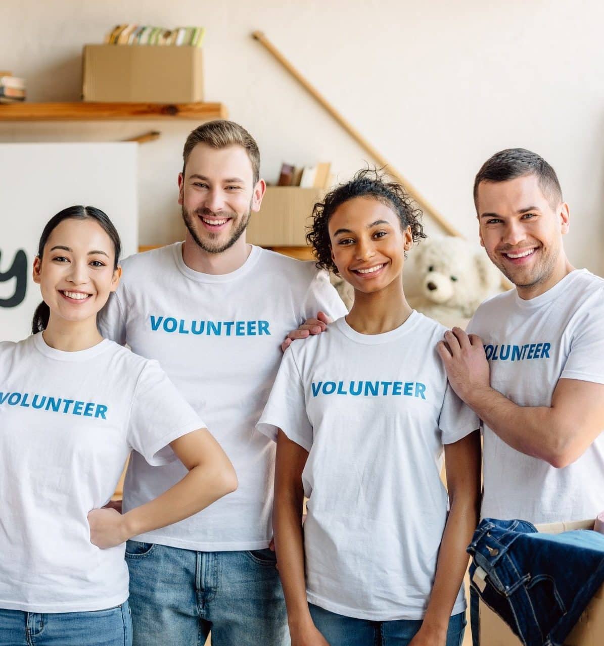 five-young-multicultural-volunteers-standing-together-smiling-and-looking-at-camera-e1657642113794.jpg